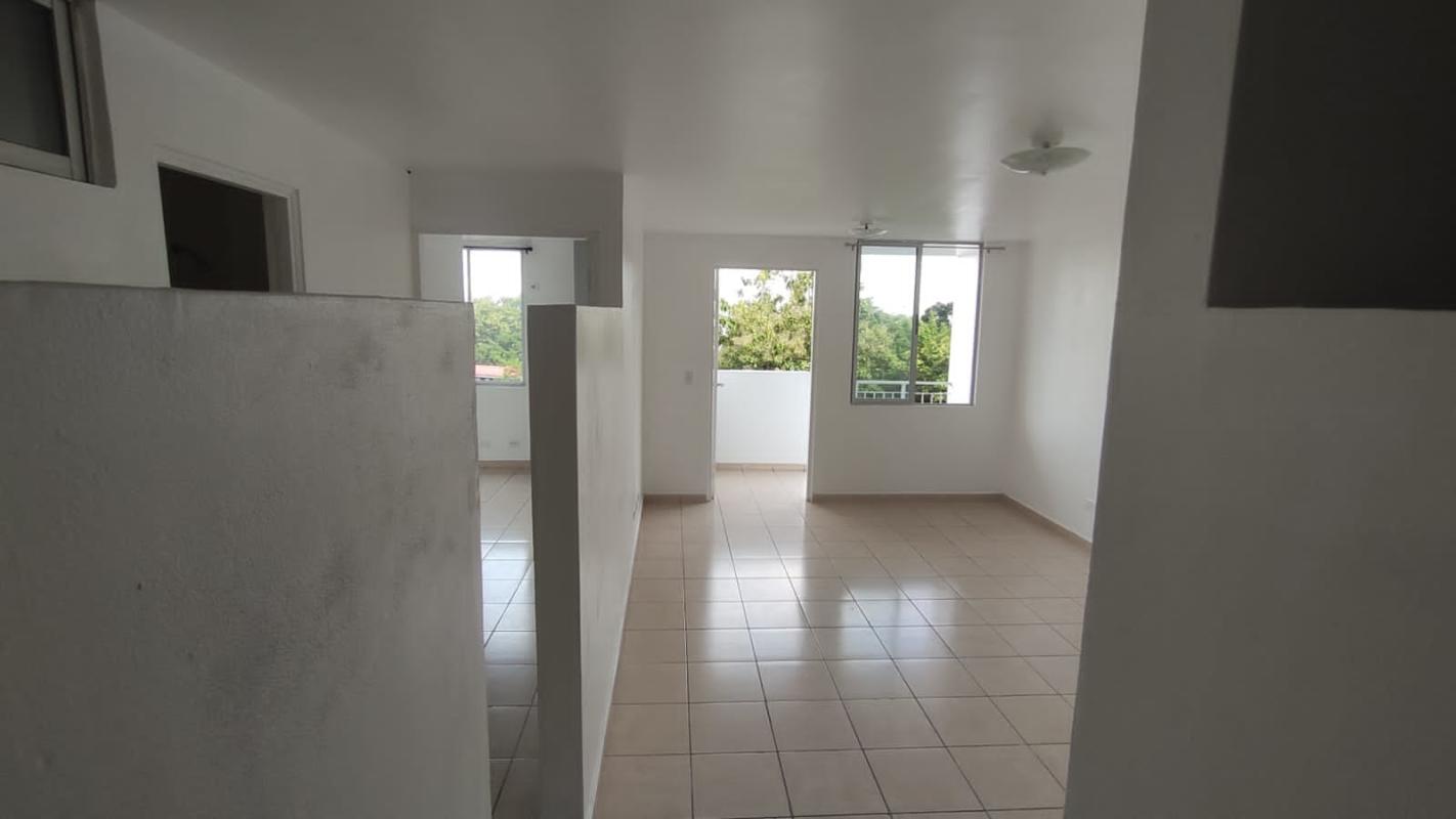 Living dining area with balcony views tiled floors in Hato Pintado apartment for rent