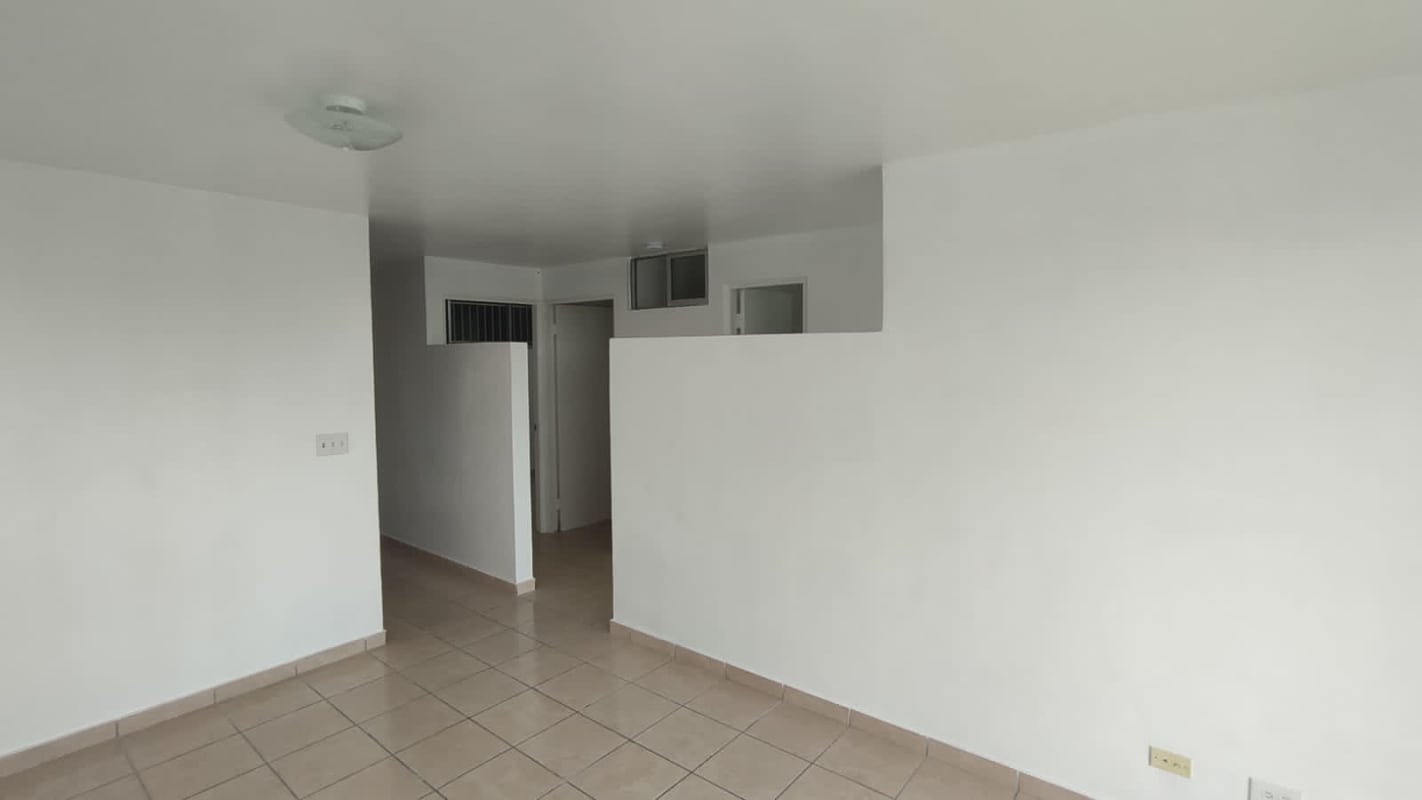 Minimalist laundry room with utility sink tile floor Panama affordable apartment