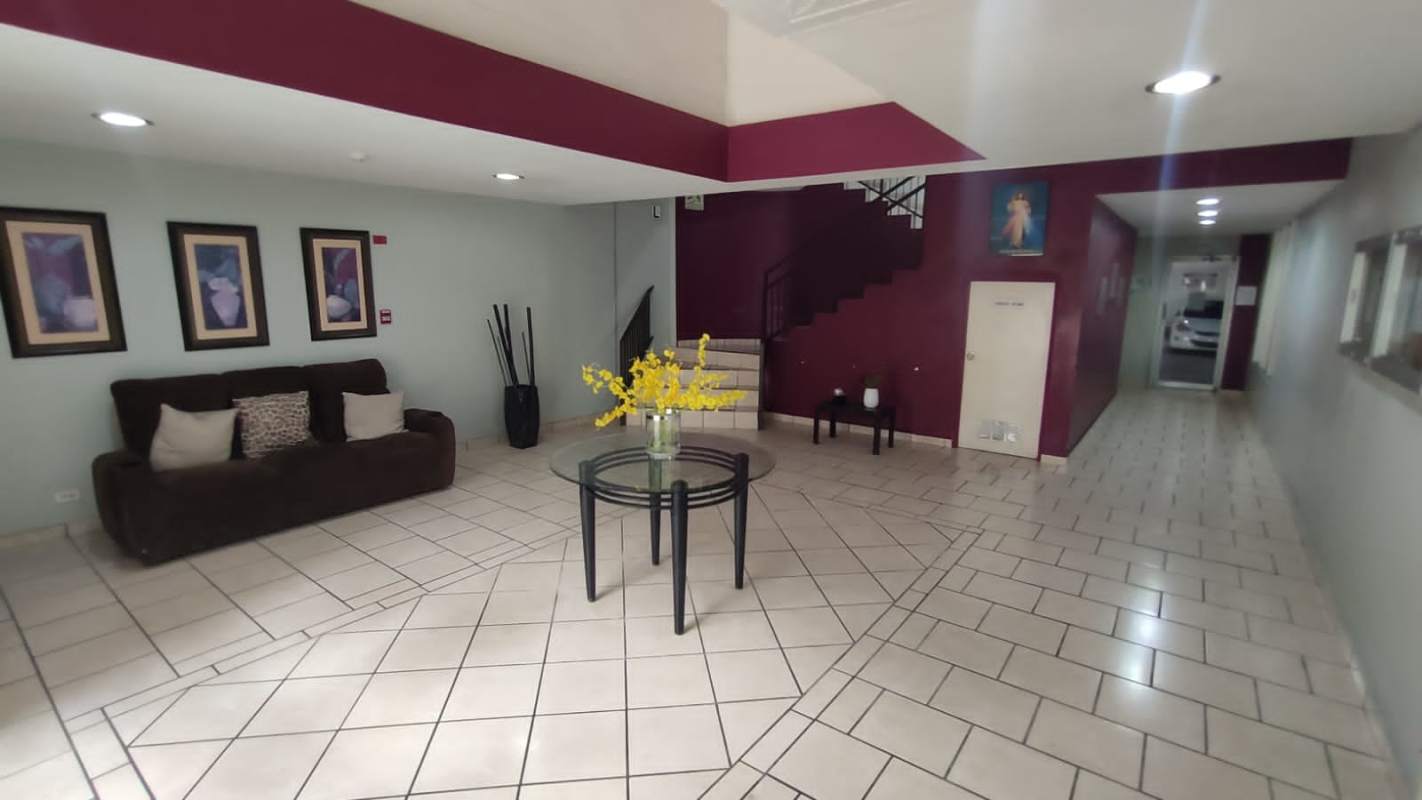 Spacious lobby with sofa glass table decorative art Hato Pintado apartment building