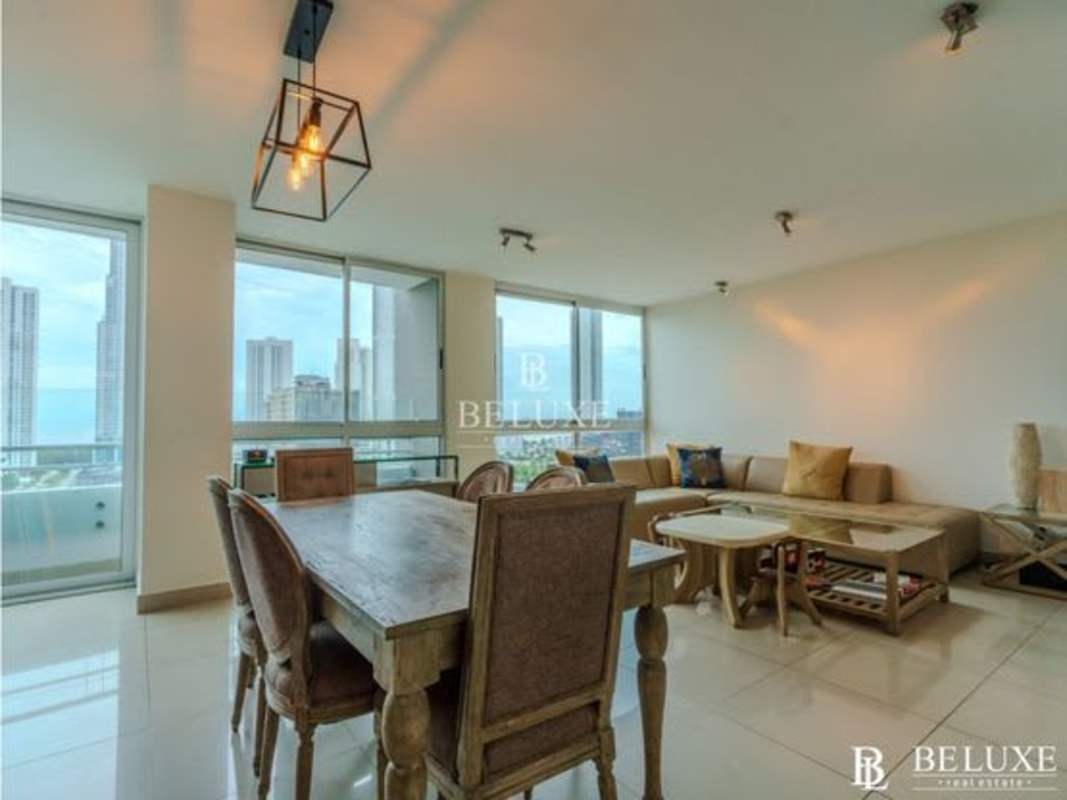 Open dining area with large windows overlooking Costa del Este skyline in PH LaCosta Tower Panama