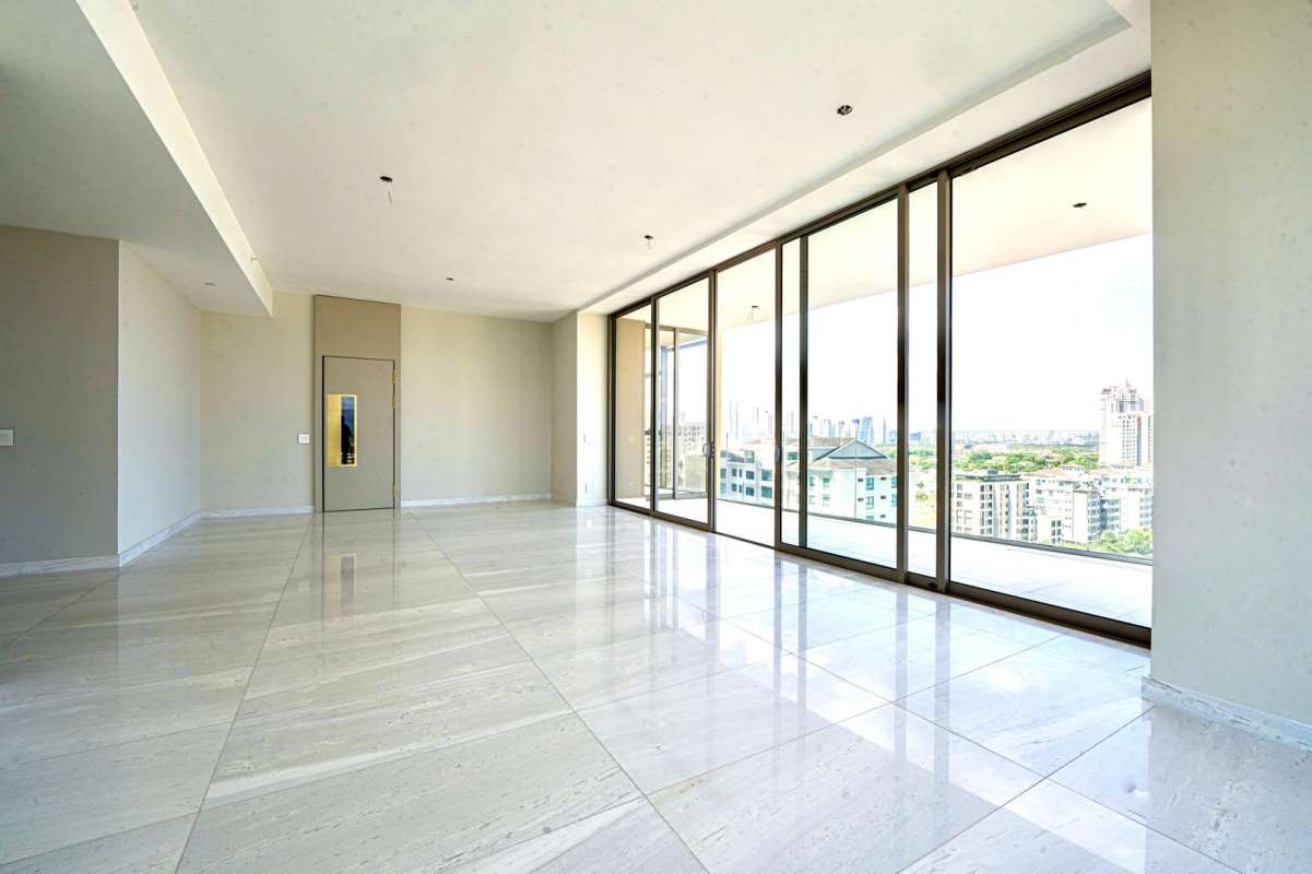 High-ceiling living room with marble floors, floor-to-ceiling windows, terrace access at Fendi Chateau Santa Maria Panama