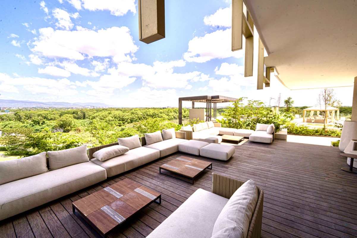 Outdoor infinity pool area with lounge chairs at Fendi Chateau Residences Santa Maria Panama