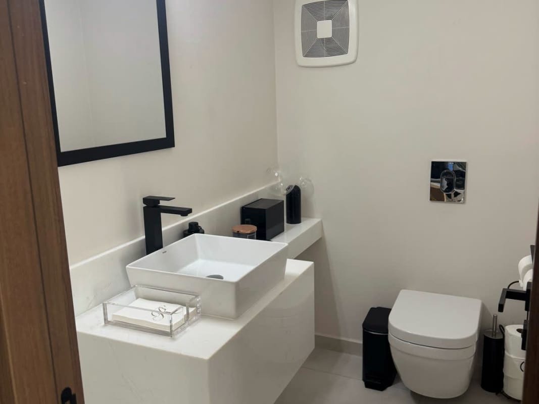 Contemporary two-story home with large covered carport and landscaped front lawn in Santa Maria Panama