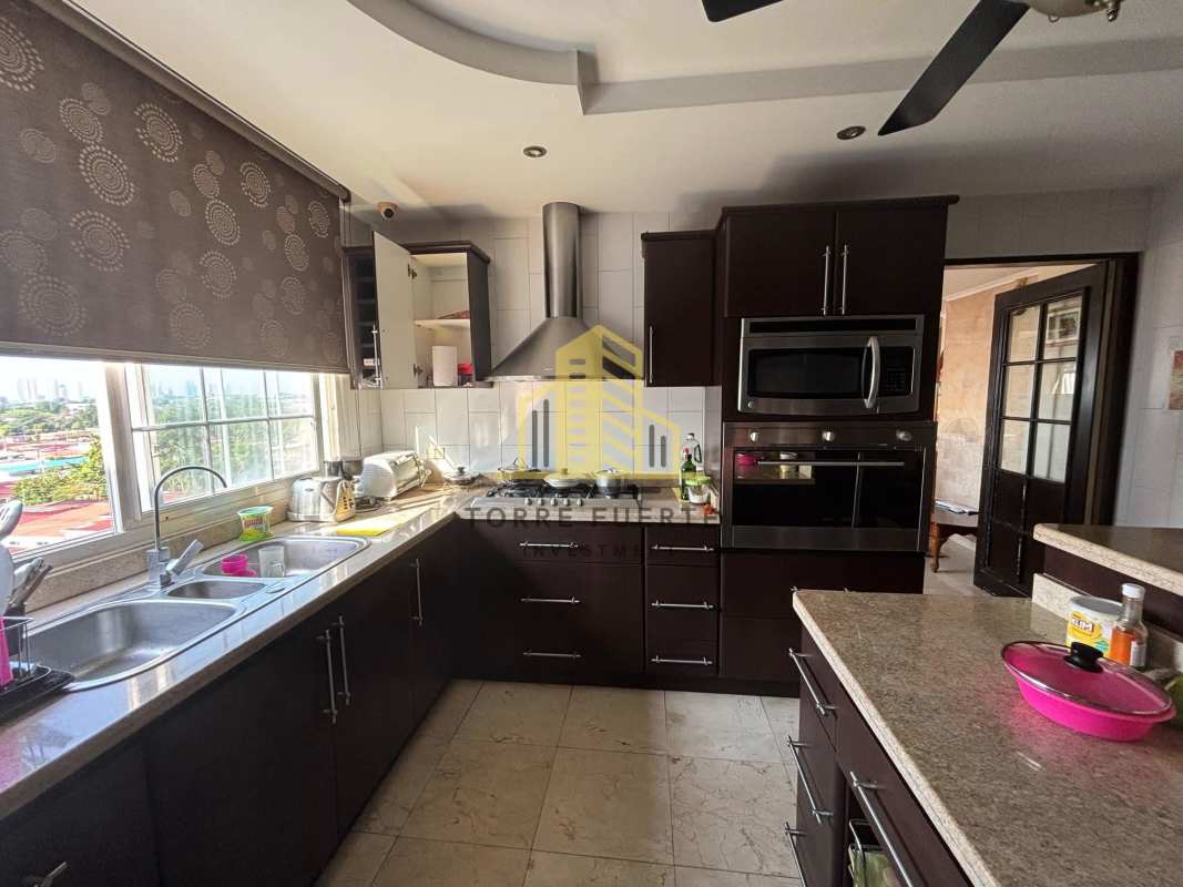 Granite kitchen modern design appliances large window city view Brisas del Golf Panama