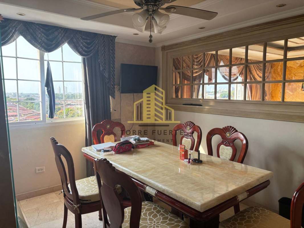 Dining room with marble table window view and ceiling fan Brisas del Golf Panama