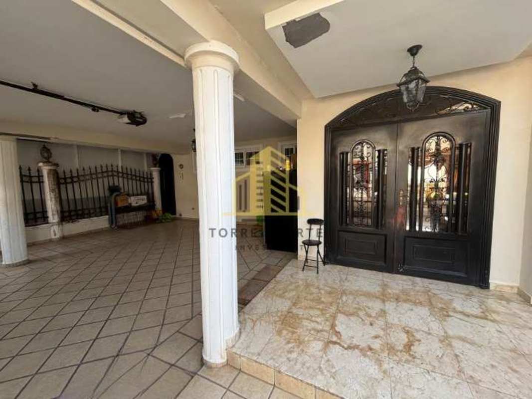 Covered Mediterranean porch with decorative columns and double doors Brisas del Golf Panama