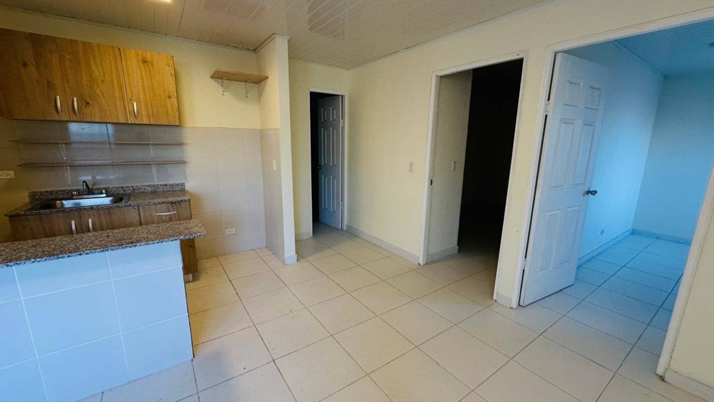 Open kitchen with granite counter and hall access Betania apartment rent Panama