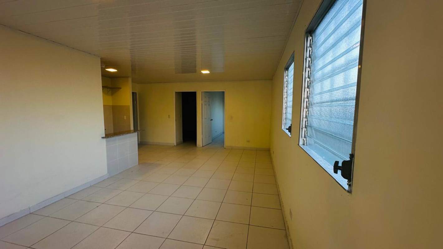 Living room open to kitchen with granite countertop apartment Betania Panama