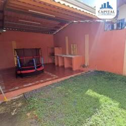 Covered terrace with lawn and outdoor sink in house for sale Las Verdes Panama
