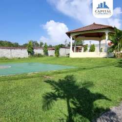 Bedroom with ceiling fan, tiled floors and window in house for sale Arraiján Panama