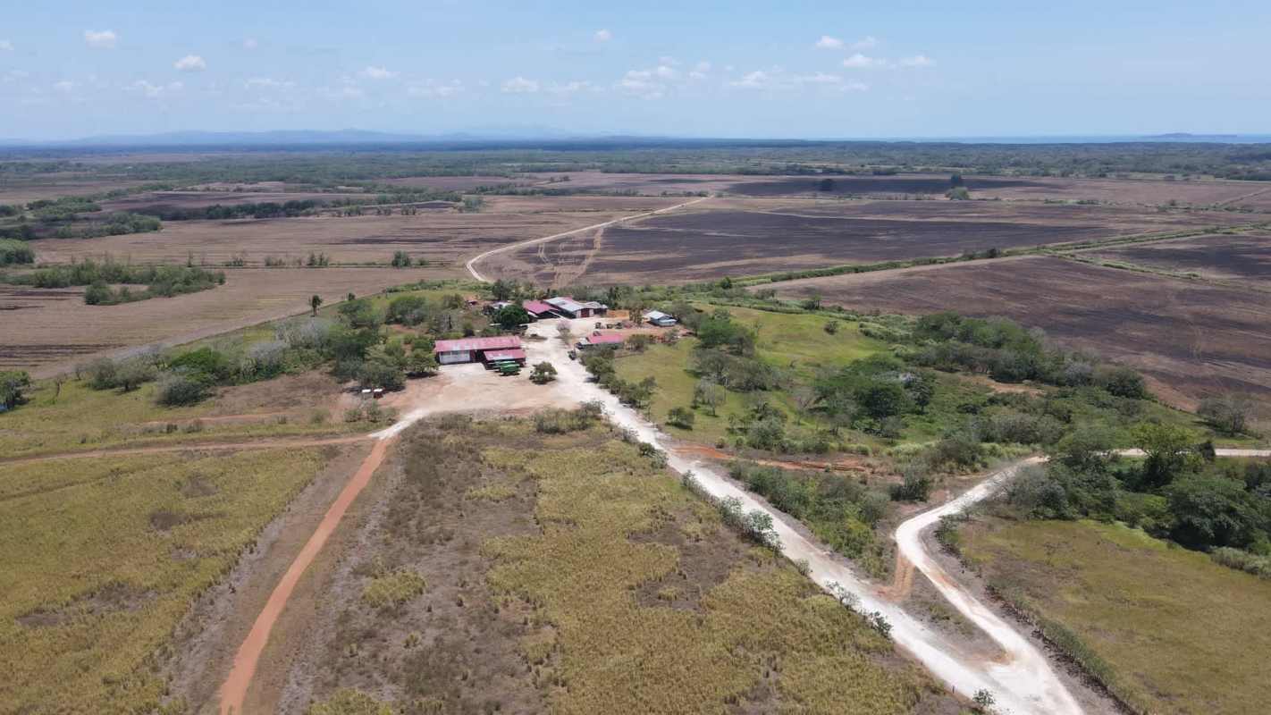Aerial photo of agricultural fields, dirt roads, small farm buildings in Pacora Panama