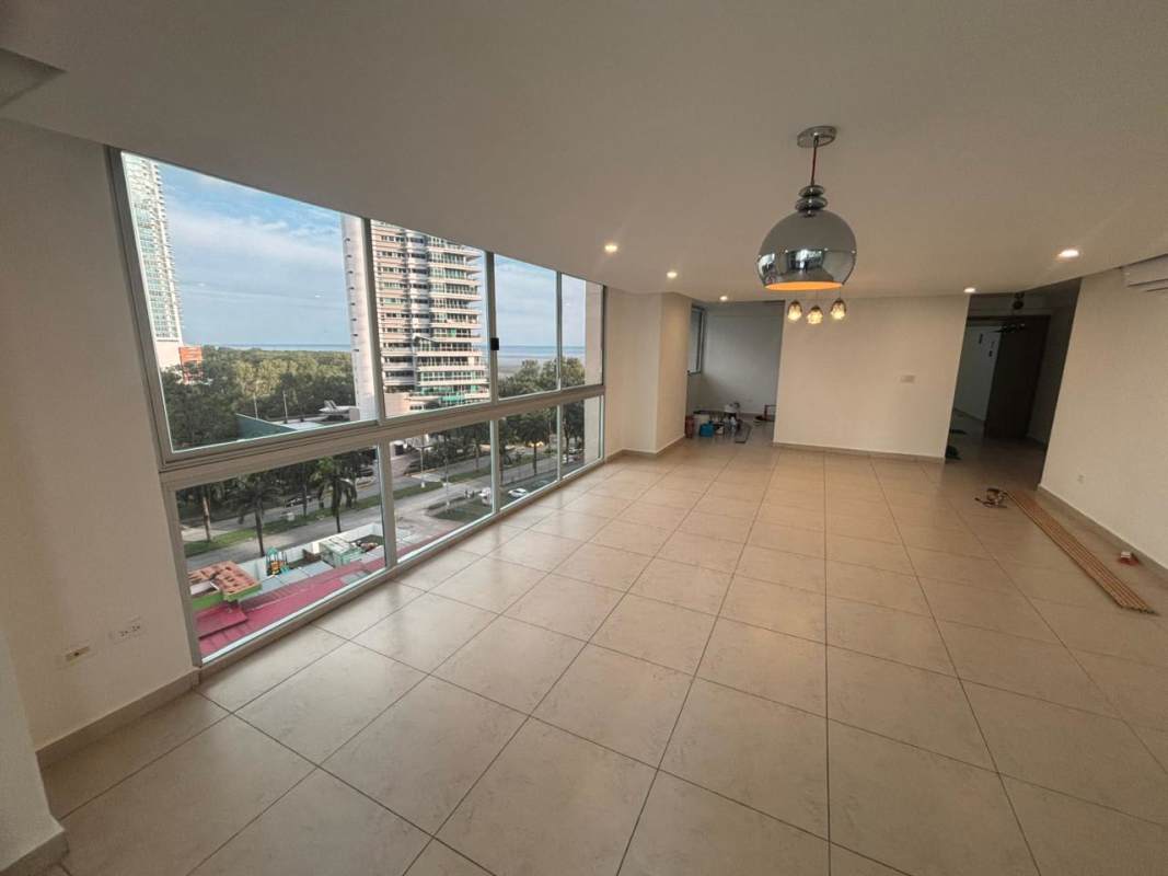 Open kitchen with granite countertops and cabinetry in PH Lumiere Costa del Este