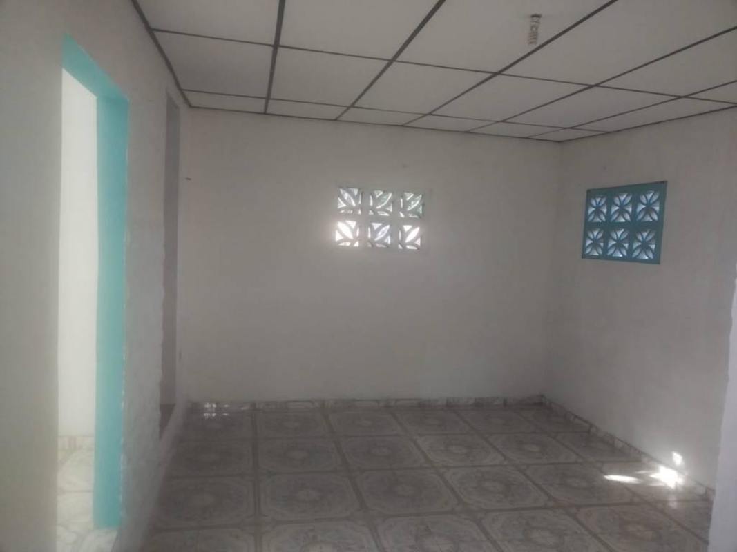 Unfurnished living area with patterned tile and glass block windows Las Mañanitas Panama