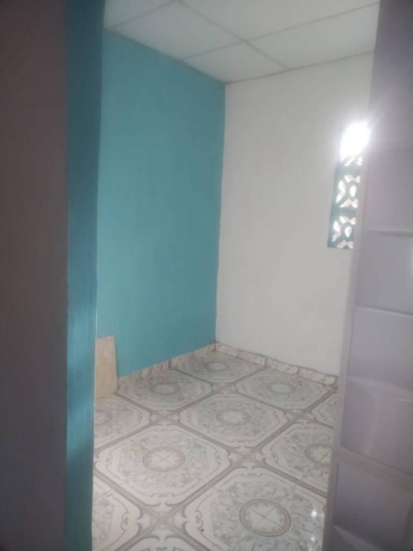 Compact bedroom with ventilation blocks and patterned tile Las Mañanitas Panama City