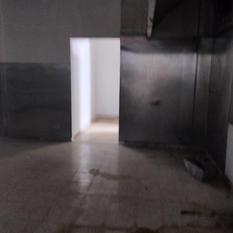 Compact prep/kitchen space with industrial walls in commercial property Panama City