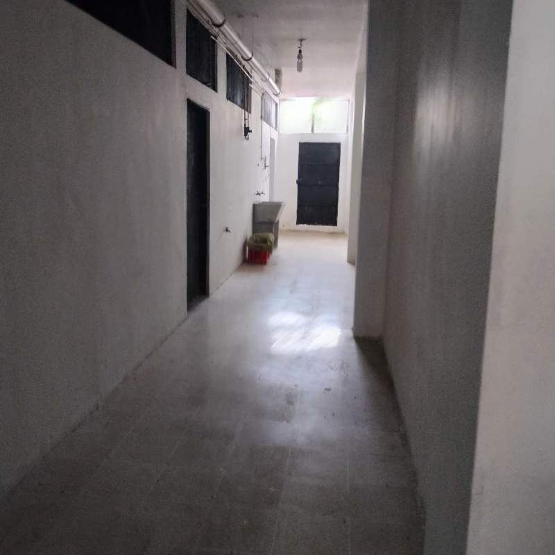 Hallway corridor with sink and bathrooms commercial unit Miraflores Plaza Panama