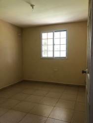 Open-plan tiled living room kitchen granite counter duplex house El Nazareno La Chorrera Panama