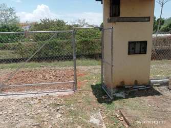 Metal chain-link fence utility box gravel ground duplex lot investment opportunity Panama