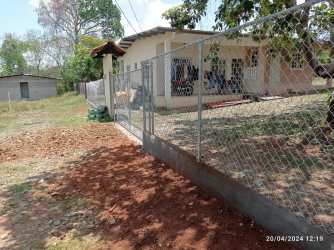 Exterior view single-story duplex fence yard house property for sale La Chorrera Panama