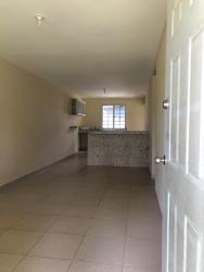 Bedroom with beige walls window ceramic tile floors El Nazareno La Chorrera Panama