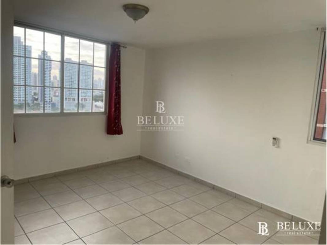Bedroom with large window bright ceramic tile floors PH Torres Mar del Sur Panama City