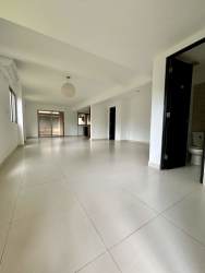Kitchen with island and wood cabinetry in Woodlands Panama Pacifico house