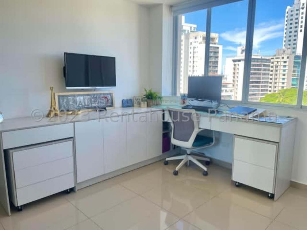 Bedroom with large window overlooking Panama City skyline at PH Sky Park Carrasquilla