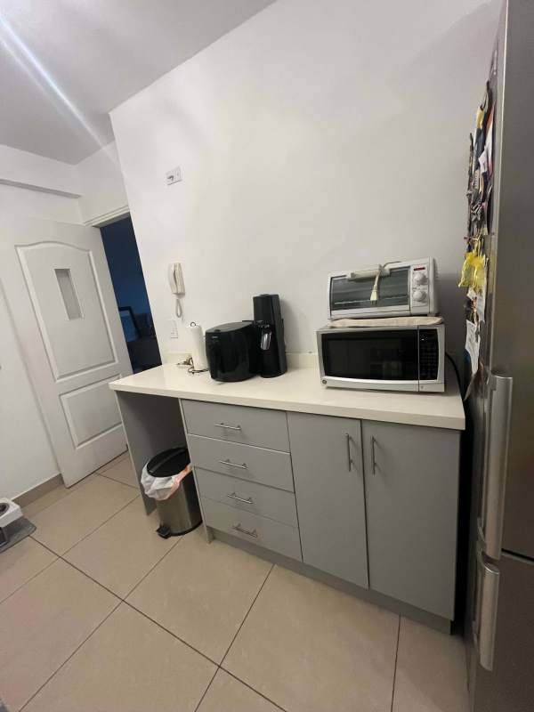 Modern living area with large windows and ocean views at PH Bahía San Francisco.