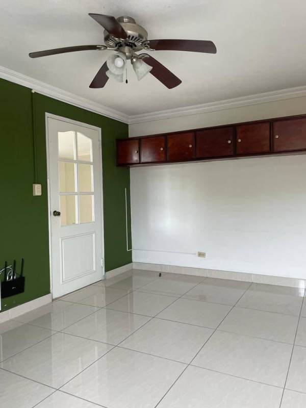 Covered patio terrace with green yard Betania Panama house for sale