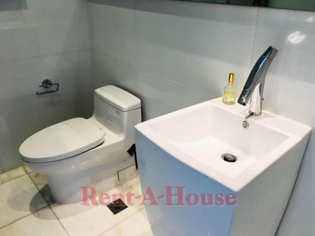 High-end modern kitchen with marble island at The Residences Punta Pacifica Panama City