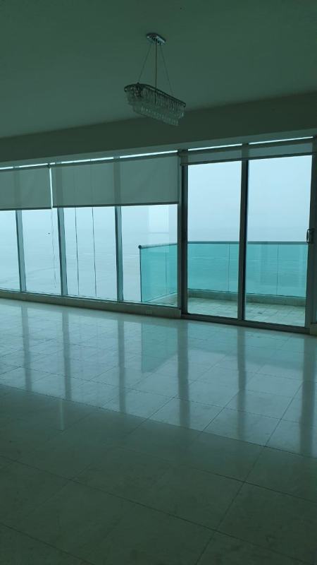 Modern kitchen with granite countertops, stainless appliances, wood cabinetry in PH Ocean Two Costa del Este