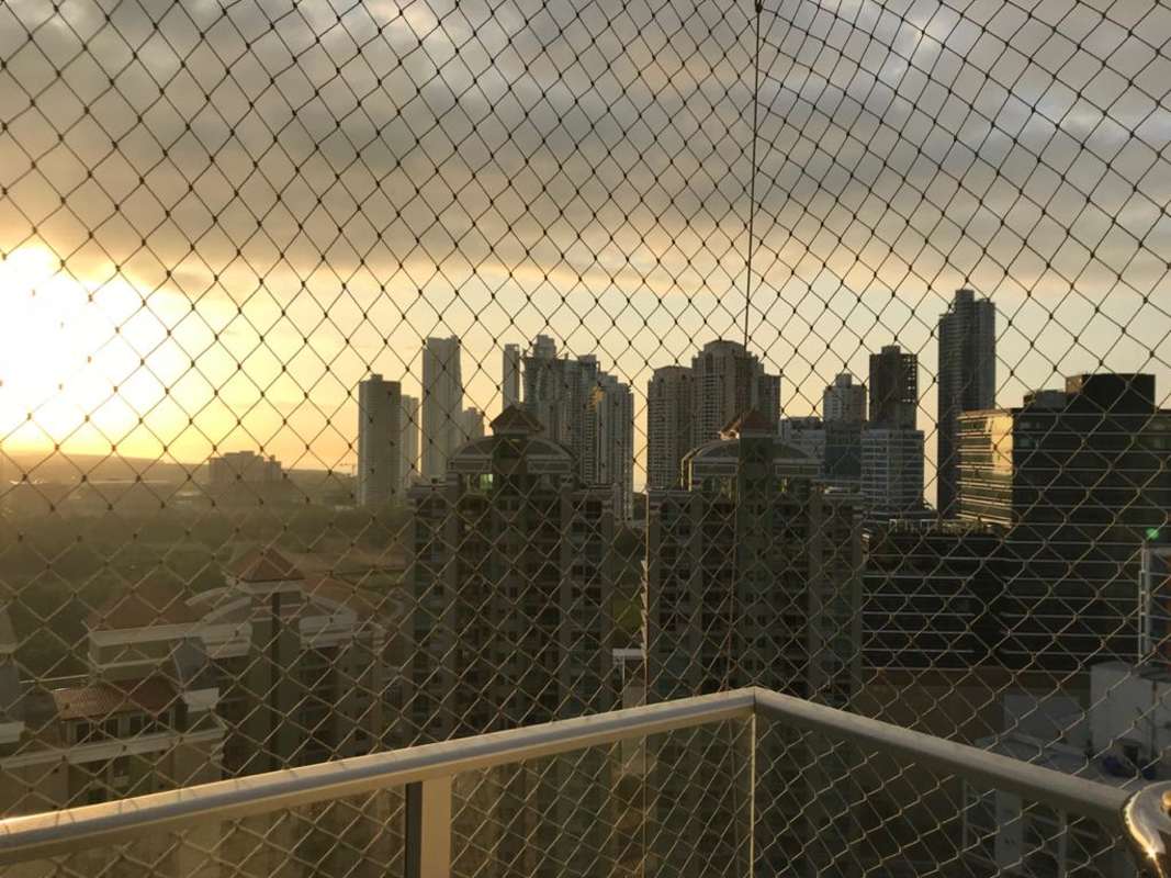Bedroom with panoramic windows showcasing ocean and skyline views, PH Top Tower Costa del Este Panama