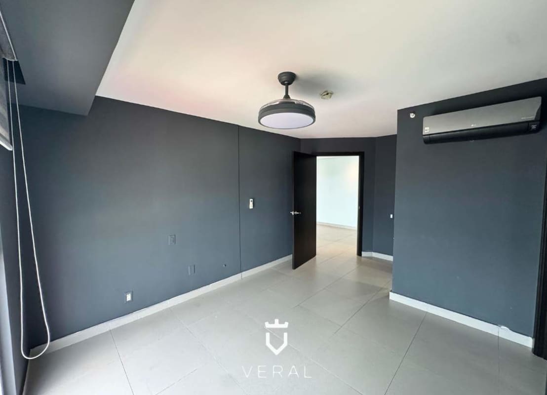 Modern kitchen with granite countertop, dark wood cabinets, marble floor in PH Simjá Altos del Golf Panama