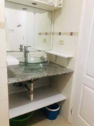 Modern bathroom with walk-in shower, sink, mirror in rental mini apartment Costa Verde Panama