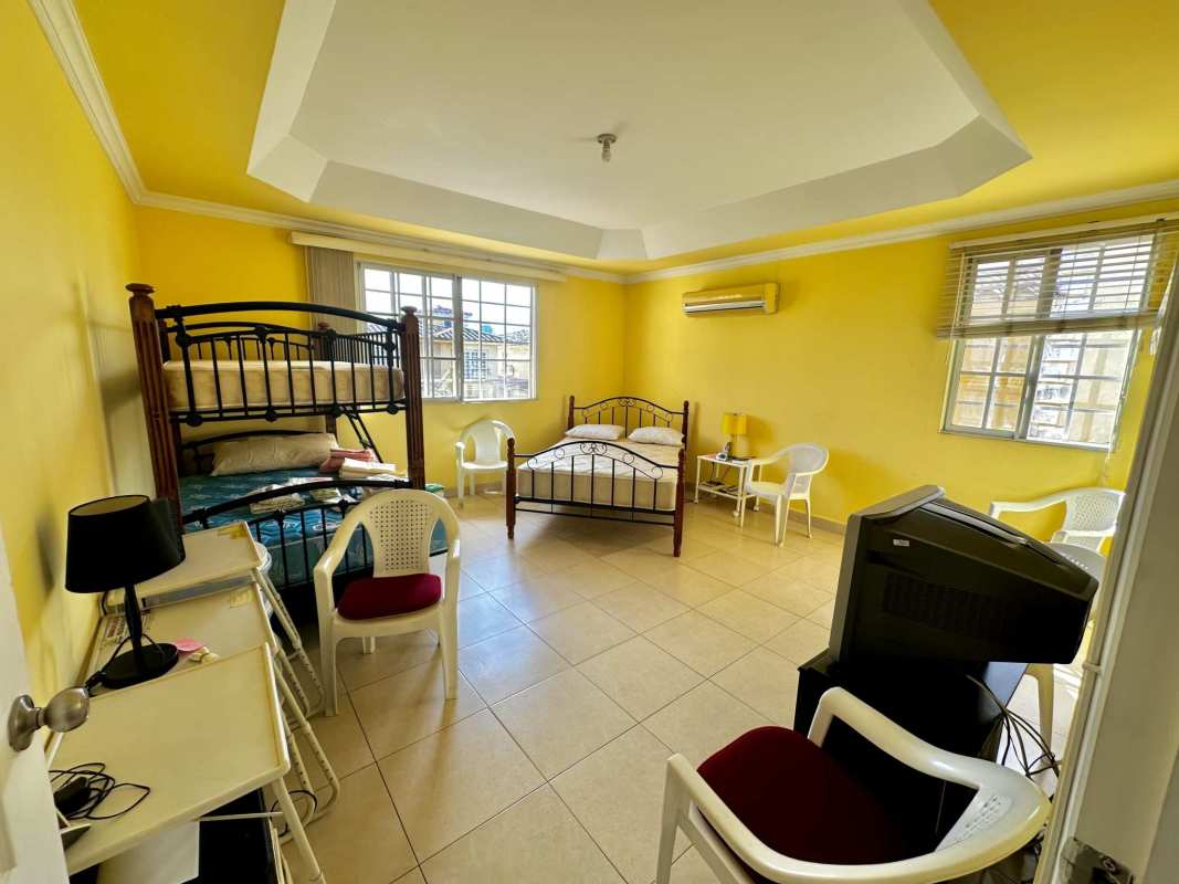 Outdoor terrace overlooking landscaped garden in gated Golden Springs Condado del Rey Panama