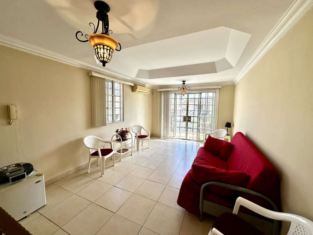 Spacious bedroom with large windows, balcony view, AC unit in Golden Springs community Panama City