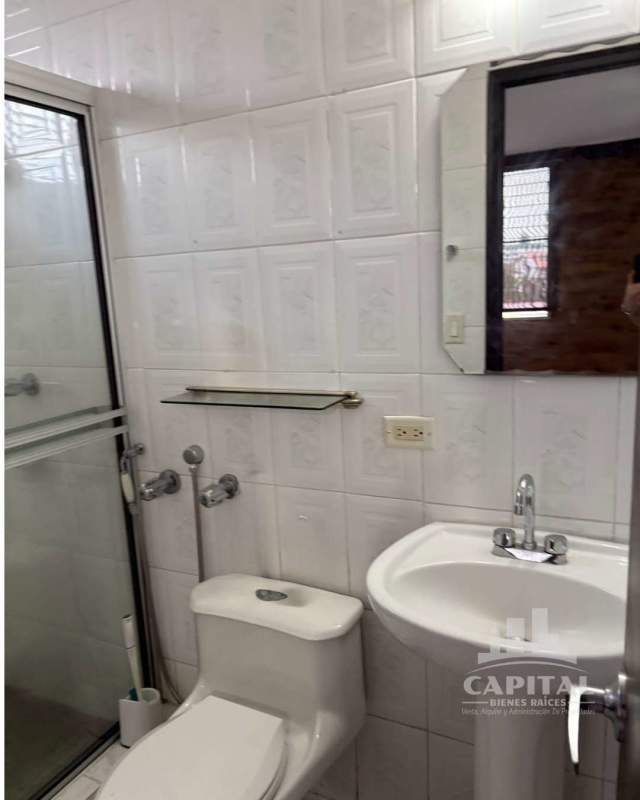 Bathroom with pedestal sink, glass shower, mirror cabinet at apartment for rent PH Dos Mares Betania Panama