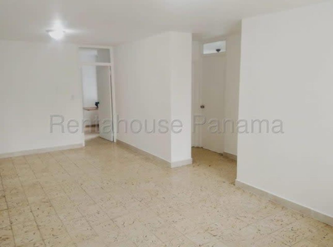 Tiled living area with ceiling lamp and entryways Parque Lefevre Panama apartment for sale