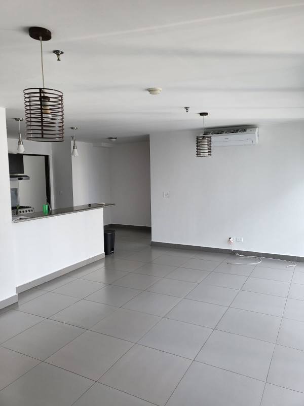 Modern bathroom with glass enclosed shower and pedestal sink in PH Colores de Bellavista Panama City