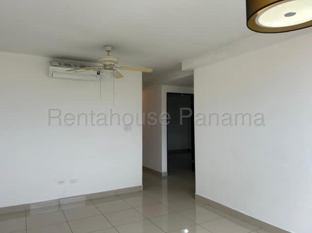 Apartment kitchen with granite countertop, gas stove, gray tile backsplash PH Centennial Panama