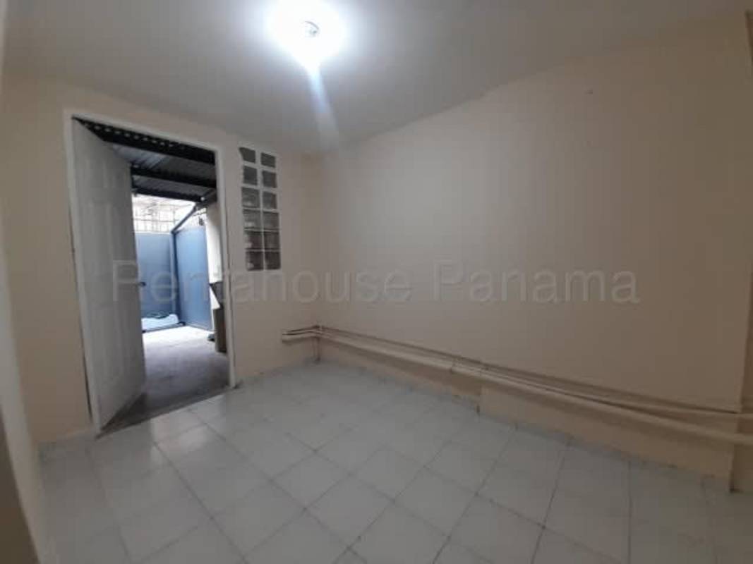 Utility area with exposed pipes cement floor PH Lefevre Park Panama