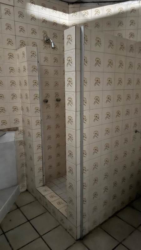 Empty industrial styled space with concrete floor, beams, window for rent Panama City