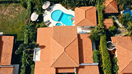 Covered outdoor terrace with lounge area by private pool in Coronado Panama rental home