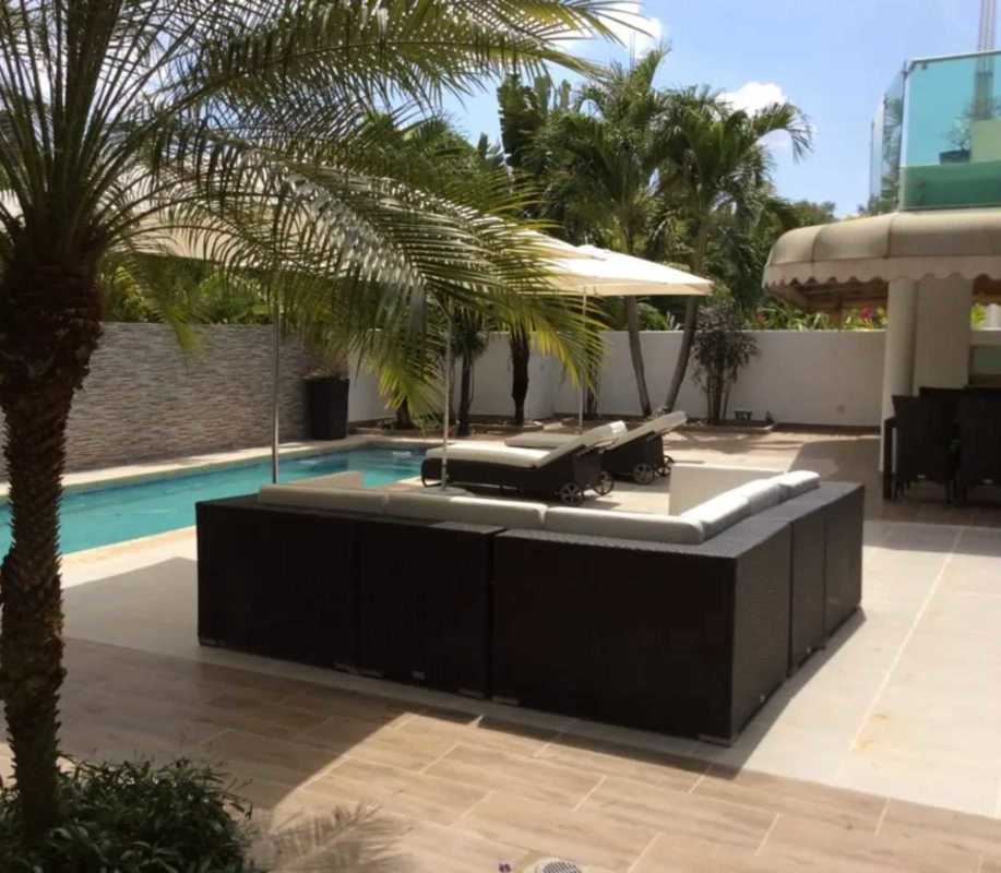 Private swimming pool with sun loungers, tropical landscaping in Costa Esmeralda Costa Sur