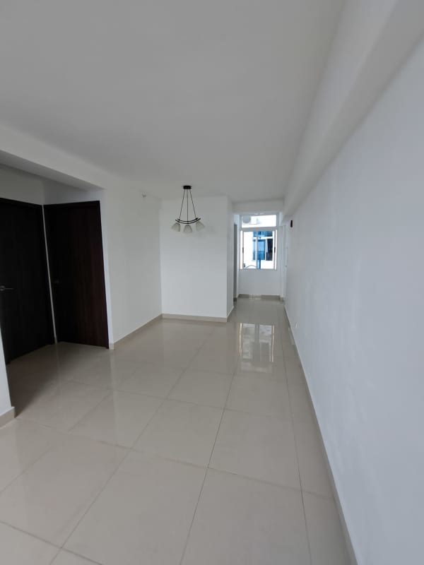 Bathroom with glass shower enclosure, vanity and tiled wall in PH Torres de Montserrat Panama City