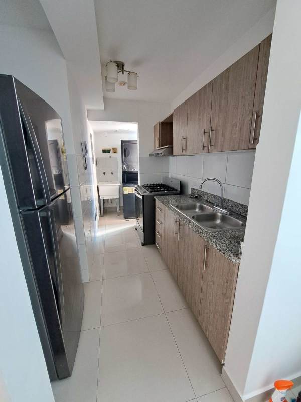 Spacious living and dining area with large window and tiled floors, PH Torres de Montserrat Panama City