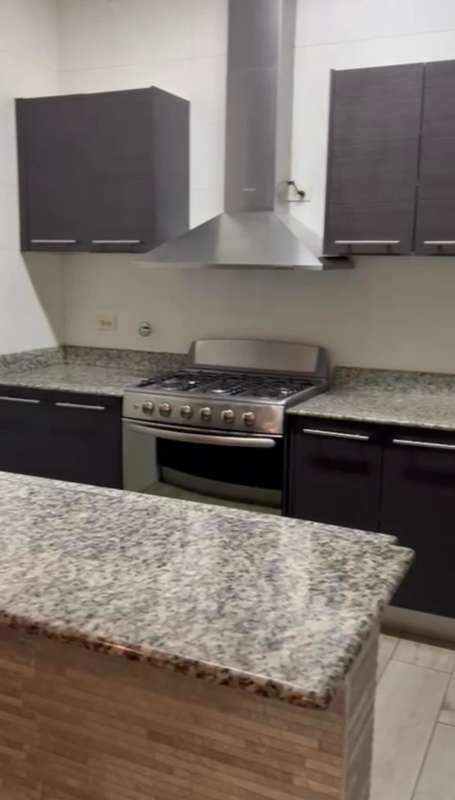Open modern kitchen granite countertop stainless appliances in PH Quadrant San Francisco Panama