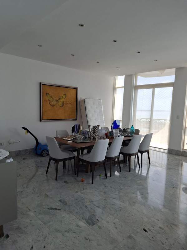 Gourmet kitchen with granite counters, wood cabinets and stainless appliances in Punta Pacifica apartment