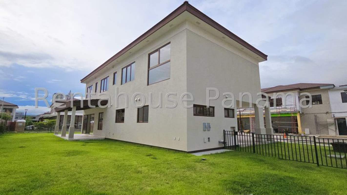 Spacious bathroom with double sink vanity and glass shower in luxury Santa Maria house Panama