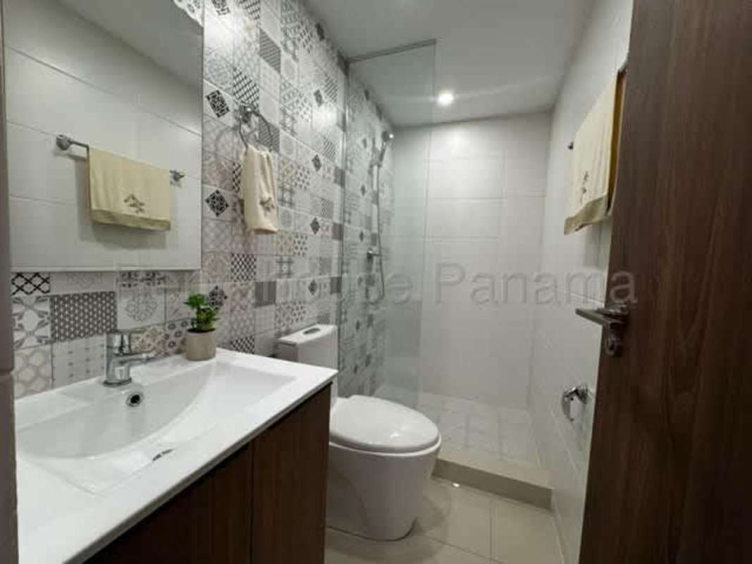 Small bathroom with glass shower, vanity in PH Torre Vista Panama City